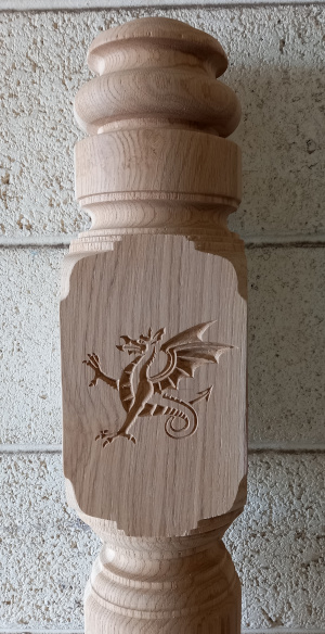 Newel post with V carved dragon design